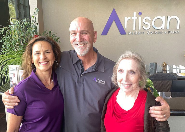 Dayna and Doug Bondon with Lauren Edgar inside Artisan's foyer during art workshop.